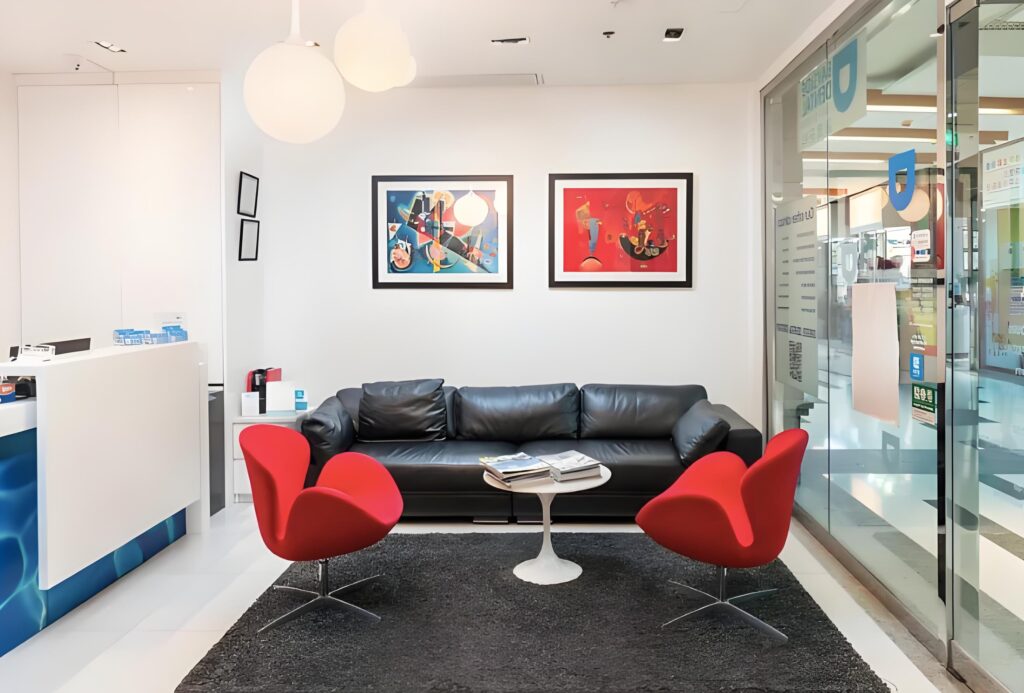 Illustration of the waiting area at aBayside Dental Tung Chung offering Orthodontic Treatment, showcasing a modern and comfortable clinic environment and reception layout.