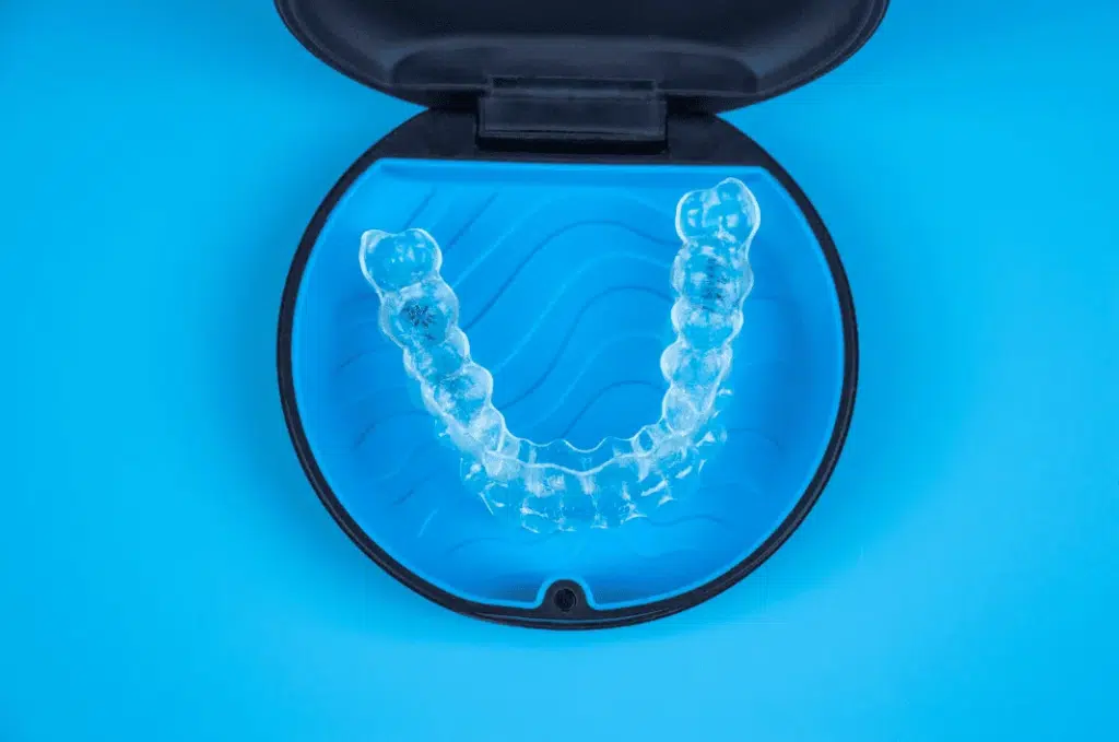 Close-up of invisible braces in a storage case. Cover image for the 2026 essential guide to invisible braces – covering orthodontic treatment steps, daily care, and pricing.